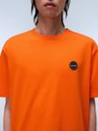 t-shirt-napapijri-s-badge-da-uomo-arancione
